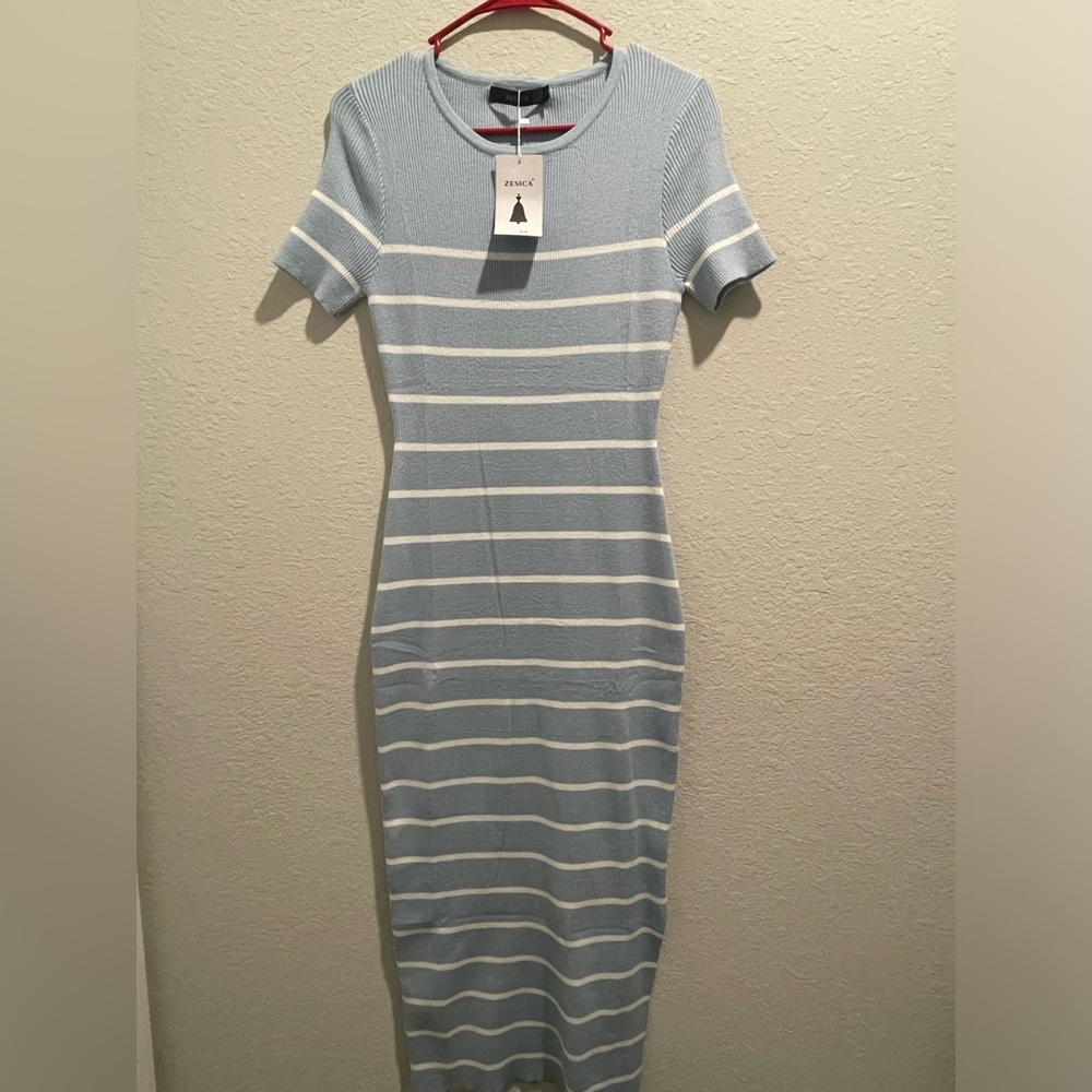 Light blue form fitting maxi dress. Medium with stretch.